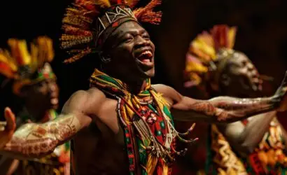 Joyful african dancers in traditional attire